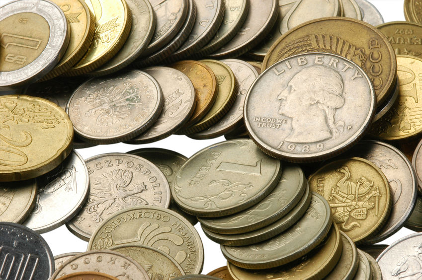 a large number of small metal money photographed close-up