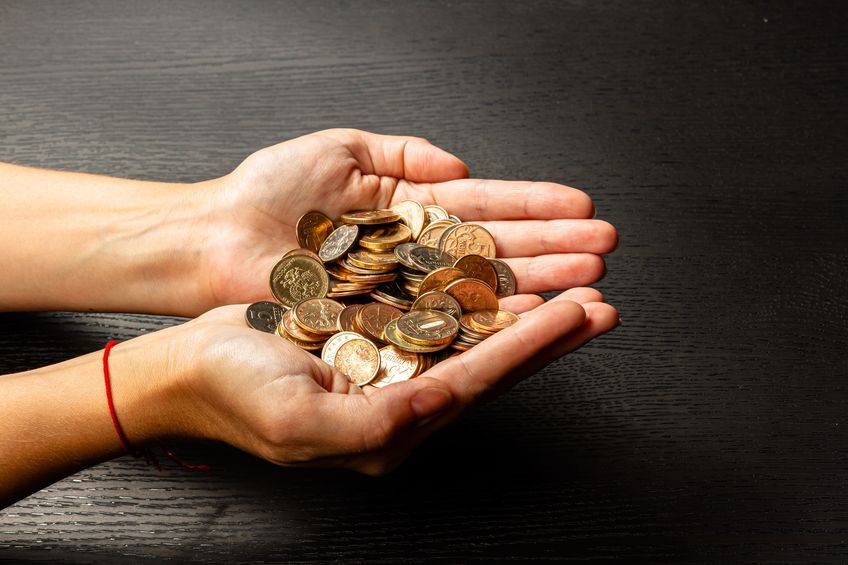 old coins in woman's hand